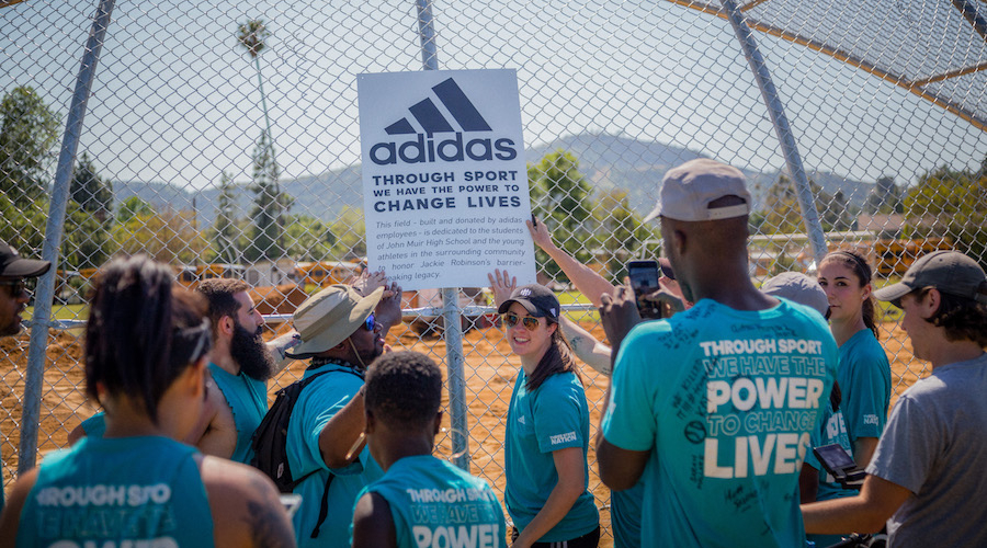 what does adidas do for the community