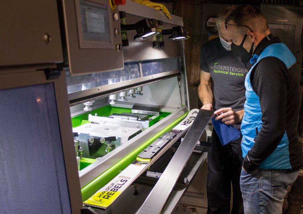 Mike Beers, Wintersteiger Service Technician and Peter Bauer from Swix evaluating a US Ski Team members race ski at the Copper Mountain Tech Center during early season training 2020-21