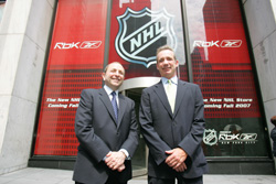 NHL Commisioner Gary Bettman and Reebok President and CEO Paul Harrington in front of the store's future location